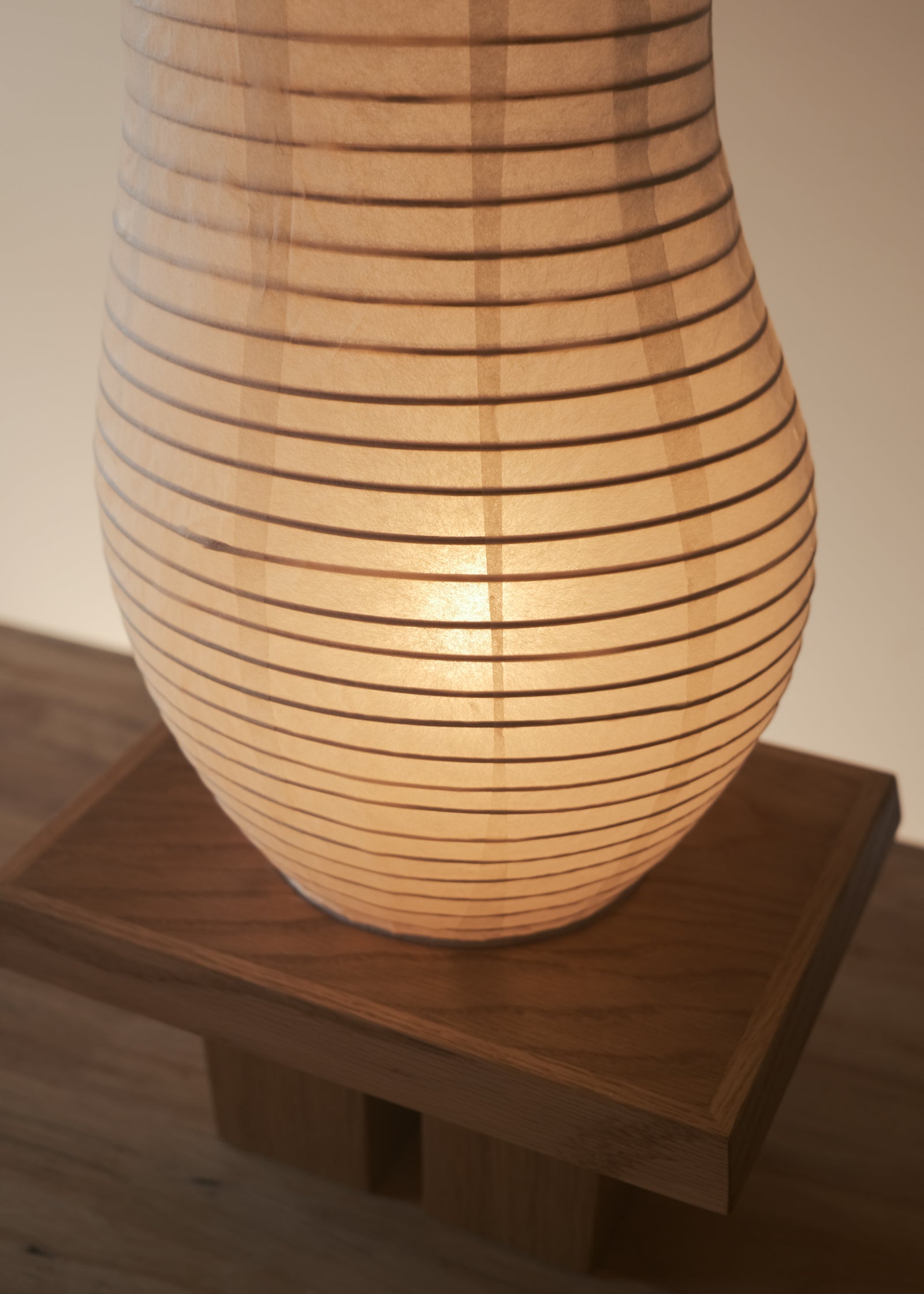 A close-up view of Kawabi's Legume Lamp made of Japanese washi and White Oak. 