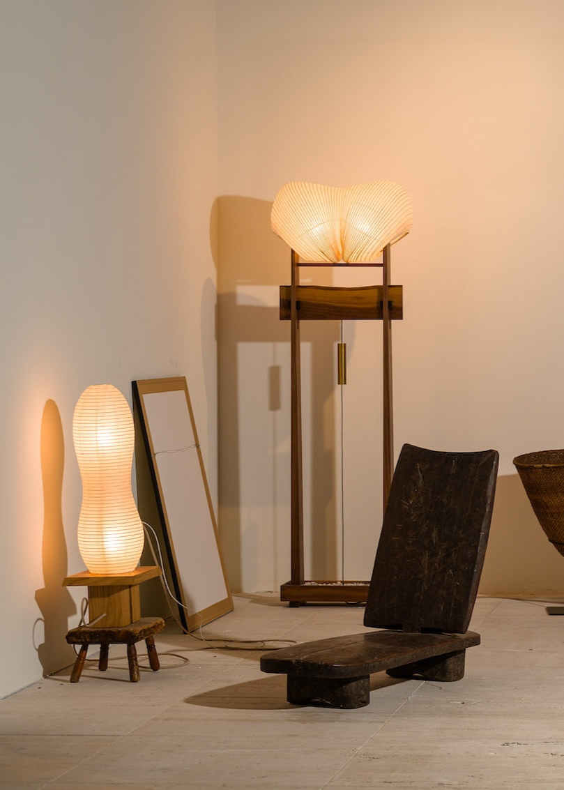 An image of Kawabi's lighting collection at Collectible New York 2024 among African antiques and contemporary artwork.