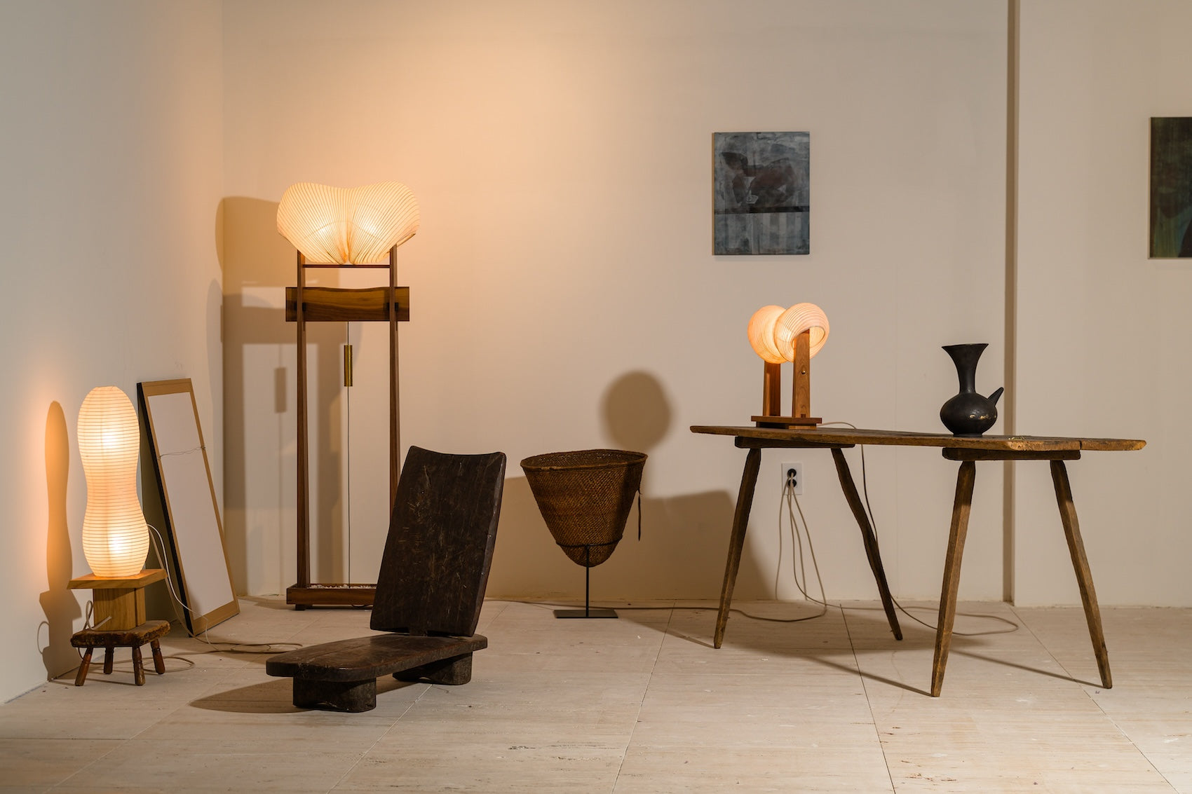 An image of Kawabi's lighting collection at Collectible New York 2024 among African antiques and contemporary artwork.