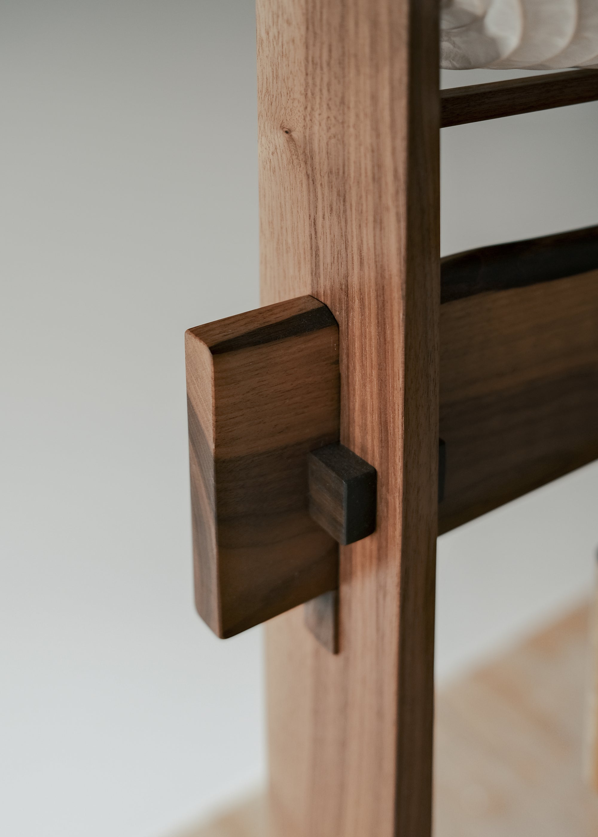 A close-up view of Kawabi's Souvenir Floor Lamp wood joinery made with traditional Japanese woodworking techniques using no glue.