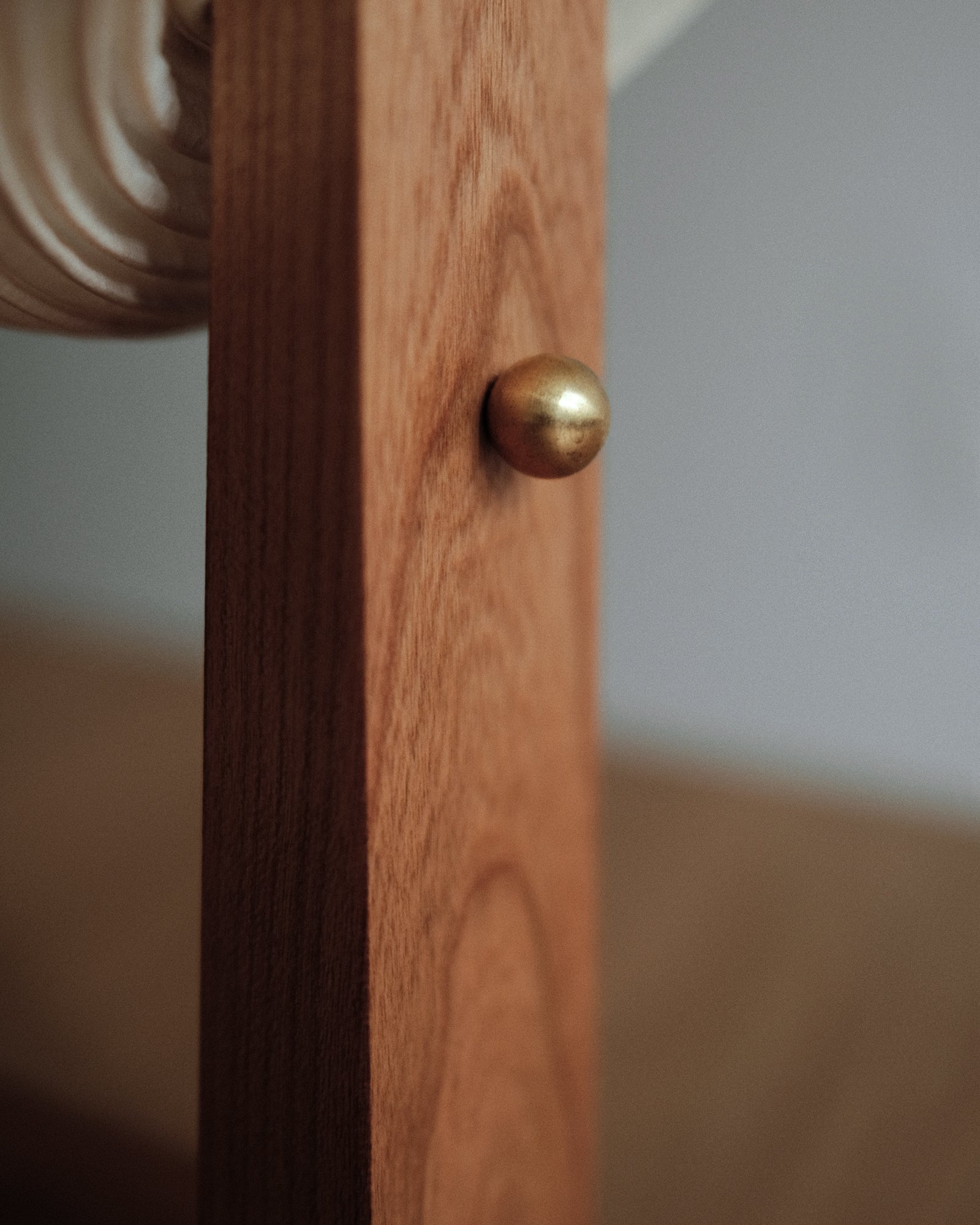 A close-up of Kawabi's Souvenir Table Lamp on the brass touch switch ball.